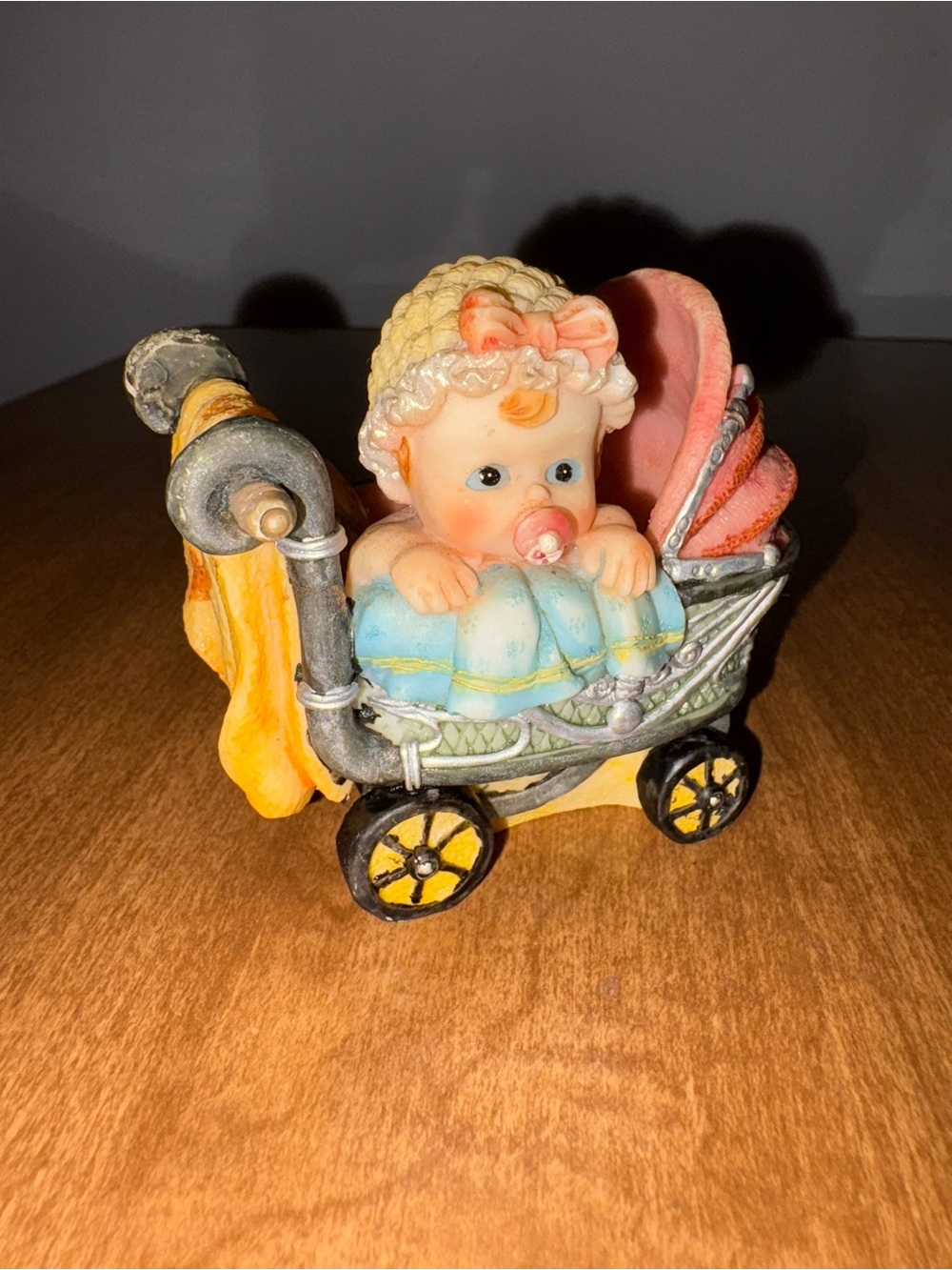 Adorable Baby in Pink Stroller Figurine